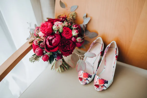 Wedding bouquet and bridal shoes