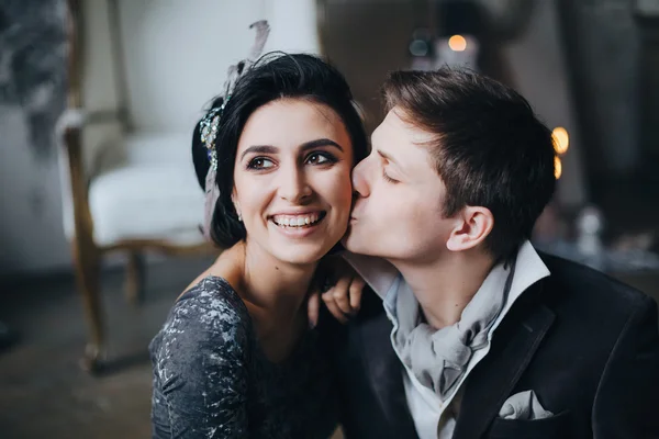 Beautiful bride and groom hugging — Stock Photo, Image