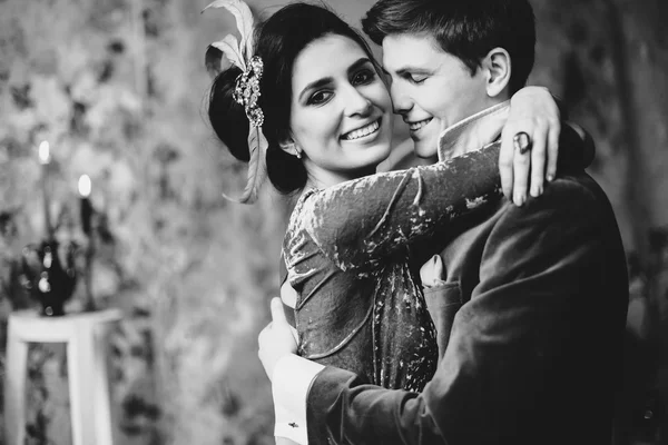 Beautiful bride and groom hugging — Stock Photo, Image