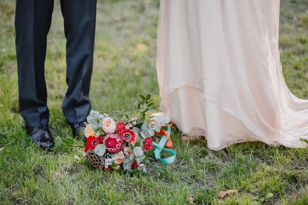 bridal bouquet on green grass