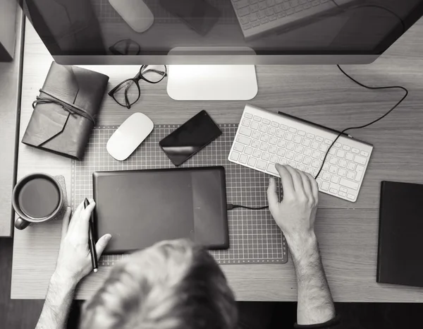 Freelance developer and designer working at home, man using desk