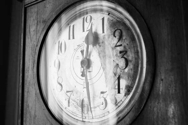 Antique grandfather clock, black and white photo, close up photo