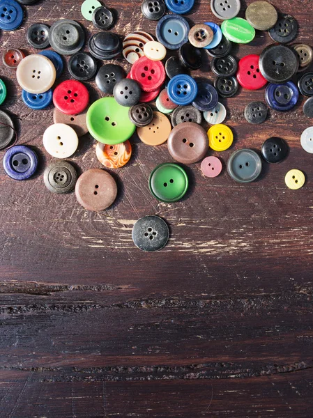 Set of vintage buttons on old wooden table — Stock Image Set of vintage buttons on old wooden table Royalty Free Stock Images