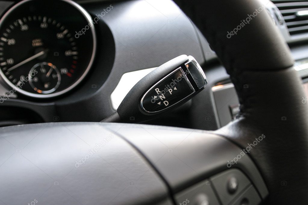 Detail on a automatic gear shifter in a new car. — Stock Photo