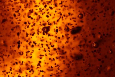 Soyut altın arka plan kabarcıkları nadir şekillerde farklıdır