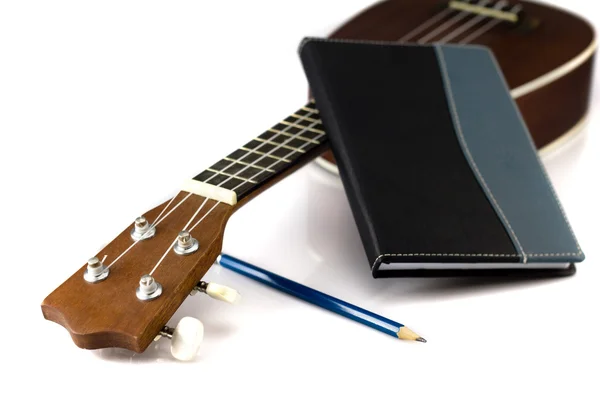 Cuaderno, lápiz y Ukulele — Foto de Stock