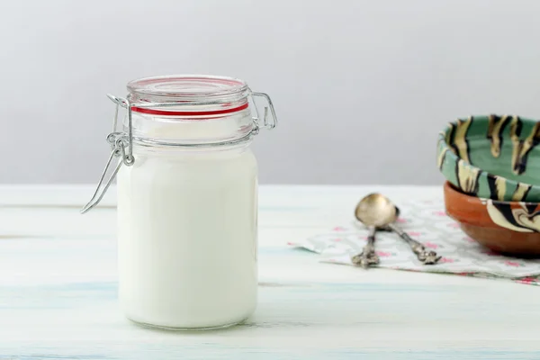 Greek yogurt in glass jar — Stock Photo, Image