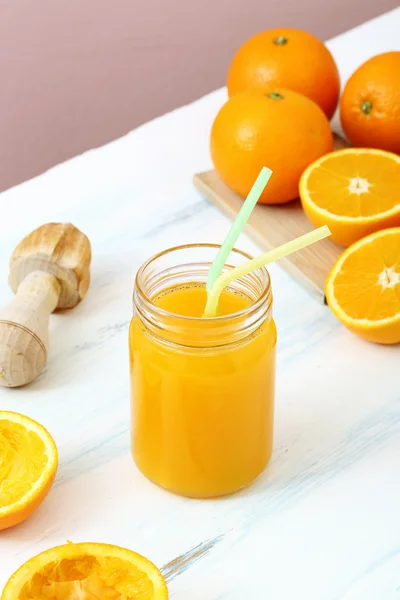 Orange juice in a glass jar — Stock Photo, Image