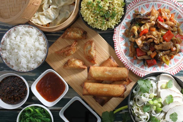 Asian fast food background spring rolls and dumpling