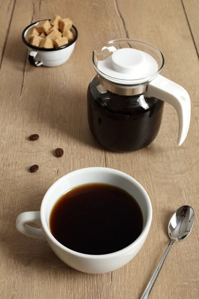 Coffee cup on wooden table — Stock Photo, Image