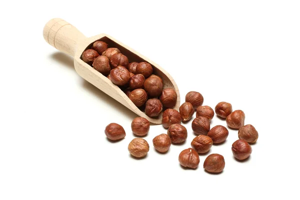 Hazelnuts in wooden spoon Stock Photo