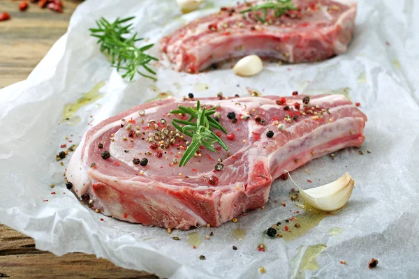 Raw pork chop steaks — Stock Photo, Image