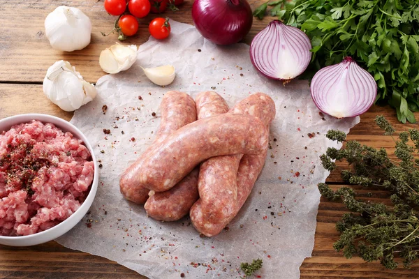 Raw sausage with spices  background — Stock Photo, Image