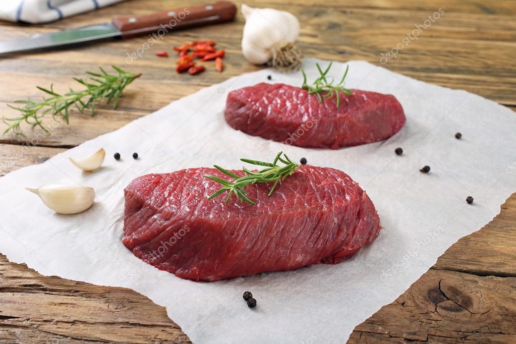 Fresh raw beef steaks with spices