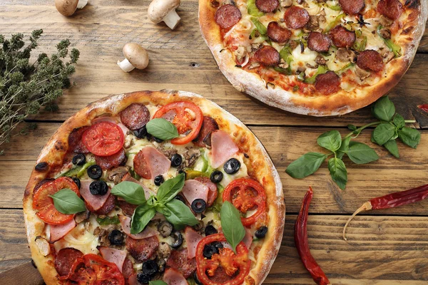 Top view pizza margherita with ham and tomato on rustic table — Stock Photo, Image