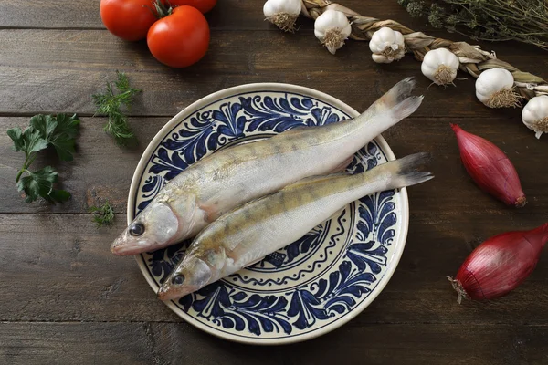 Raw fishes in plate — Stock Photo, Image