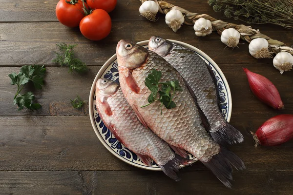 Raw fishes in plate — Stock Photo, Image