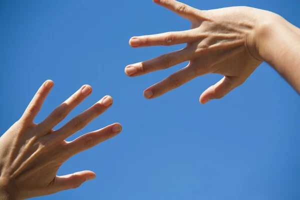 Hands on the blue sky — Stock Photo, Image