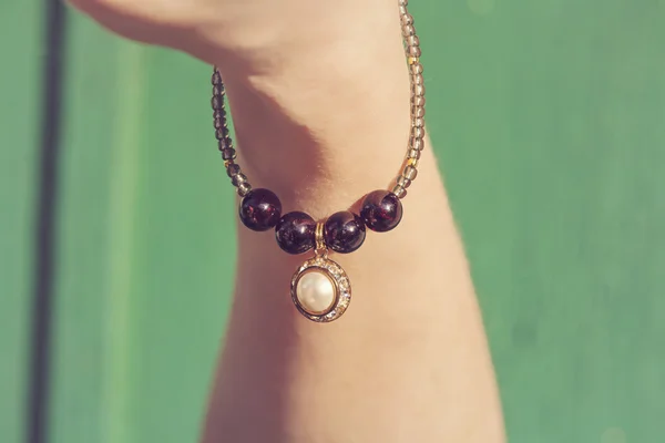 Bracelet with pearl pendant — Stock Photo, Image