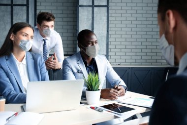 Job interview with the employer, business team in medical masks listen to candidate answers clipart