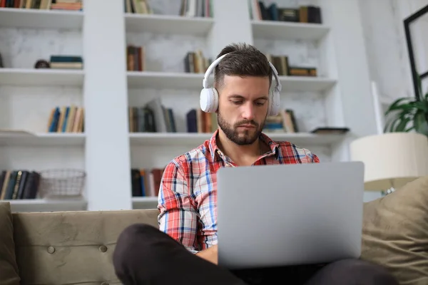 Concentrated Young Freelancer Businessman Sitting Sofa Laptop Working Remotely Online — Stock Photo, Image