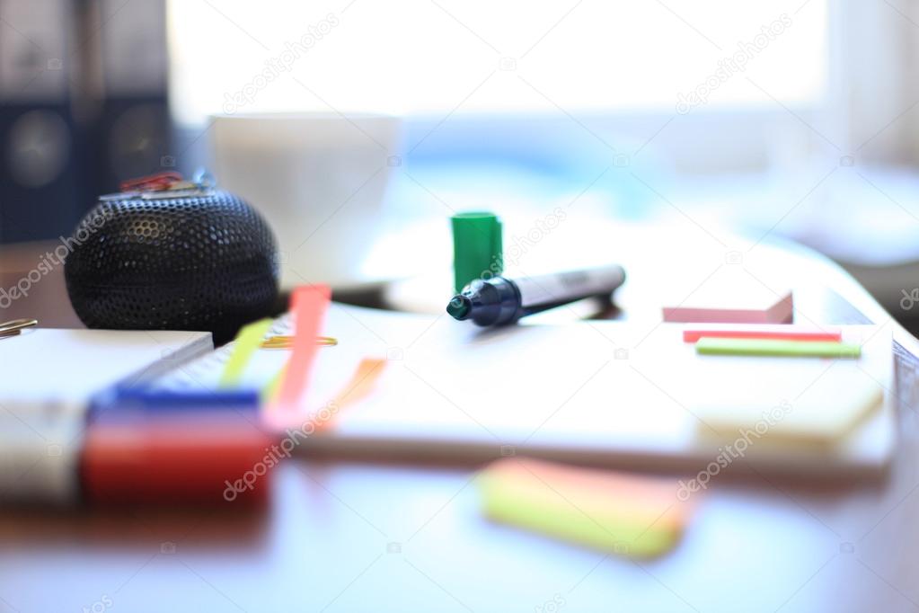 Blank sheet and stationeries with cup of coffee on the table