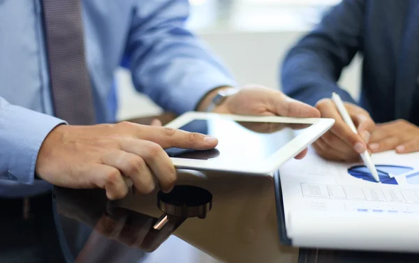 Business adviser analyzing financial figures — Stock Photo, Image