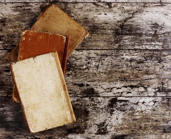 Top view of ancient books on wooden table — Stock Photo, Image