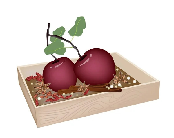 Boże Narodzenie jabłka i przyprawy w drewniany pojemnik — Wektor stockowy