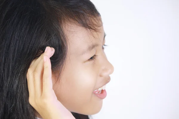 Menina com gesto de escuta — Fotografia de Stock