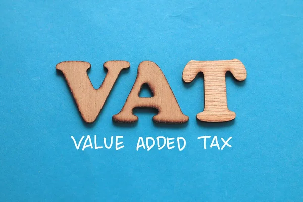 VAT Value added tax, text words typography written on blue background, life and business motivational inspirational concept