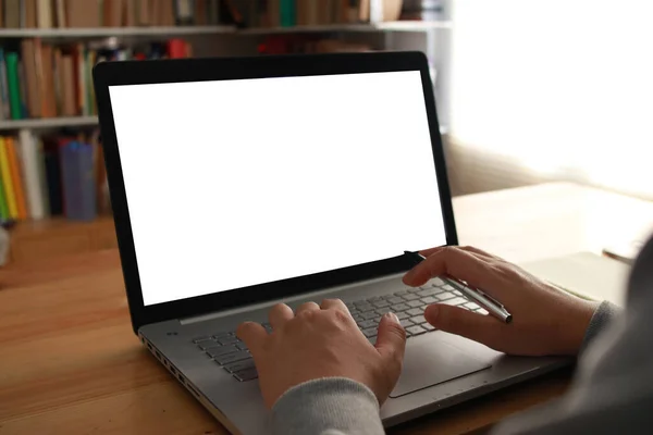 Close up image of  laptop mock up, pc computer monitor with white screen template, man typing on laptop