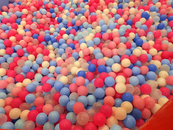 Colorful balls texture in ball pool. Children playing ground, empty no people