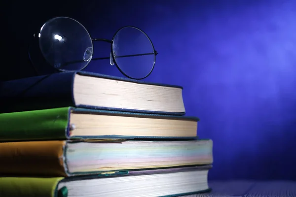 Close Books Glasses Light Blue Background Educational Concept Copy Space — Stock Photo, Image