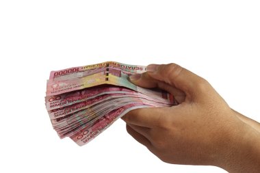 100000 Rupiah holding