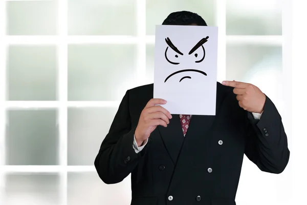 Geschäftsmann mit wütender Gesichtsmaske — Stockfoto