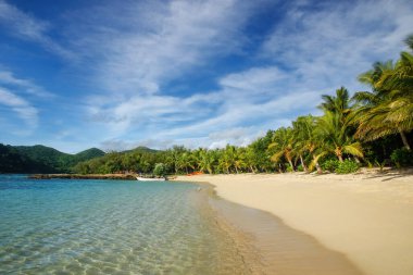 Sandy beach on Drawaqa Island, Yasawa Islands, Fiji. This archipelago consists of about 20 volcanic islands clipart