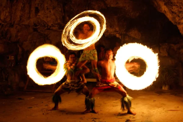 Fire show in famous Hina cave, blurred motion, Oholei beach, Ton Royalty Free Stock Images