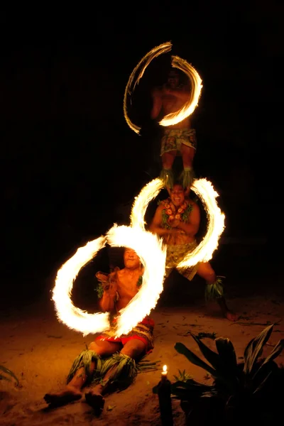 Fire show in famous Hina cave, blurred motion, Oholei beach, Ton Royalty Free Stock Images