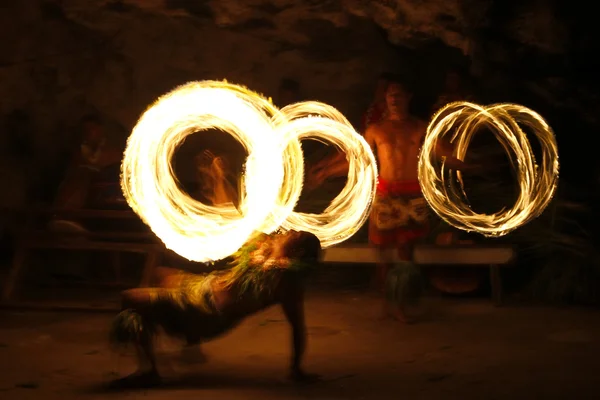 Fire show in famous Hina cave, blurred motion, Oholei beach, Ton Royalty Free Stock Photos