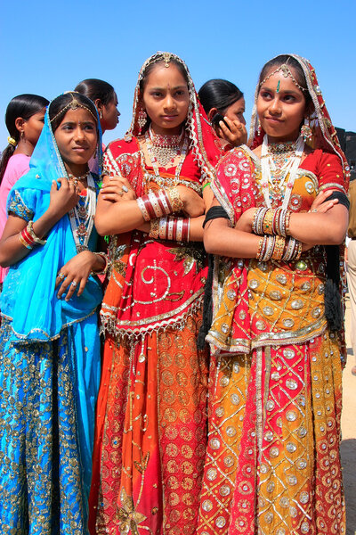 Young women in traditional dress taking part in Desert Festival,