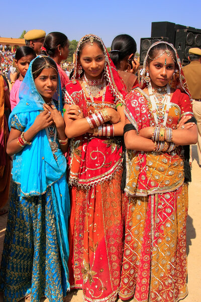 Young women in traditional dress taking part in Desert Festival,