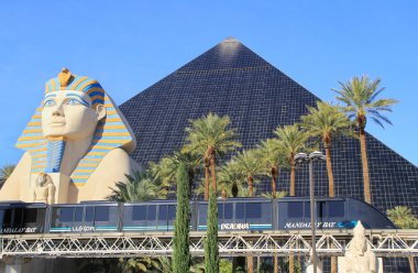 LAS VEGAS, USA - MARCH 19: Luxor hotel and casino and Mandalay Bay tram on March 19, 2013 in Las Vegas, USA. Las Vegas is one of the top tourist destinations in the world. 