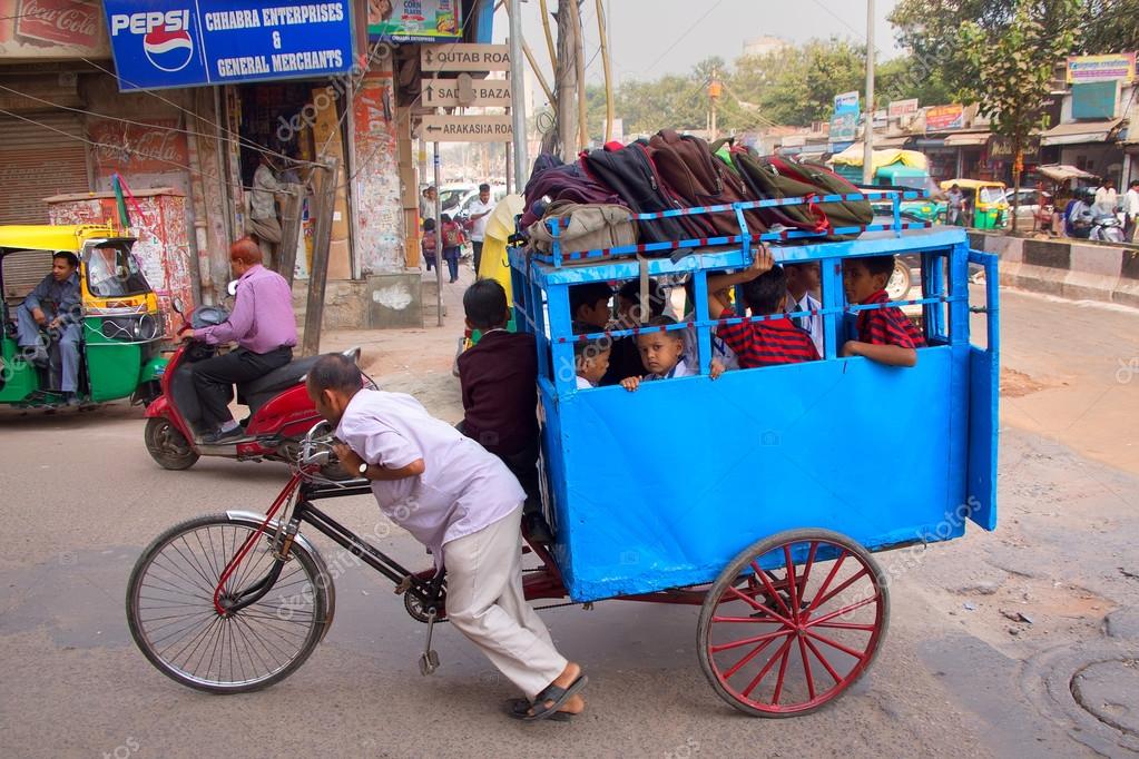 DELHI, INDIA NOVEMBER 5: Unidentified kids take cycle rickshaw