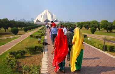 People walking to Lotus temple in New Delhi, India clipart