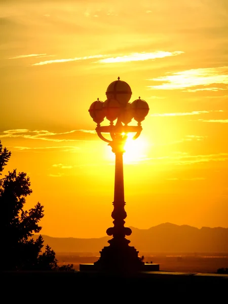 Silhouetted light pole at sunset on Capitol Hill, Salt Lake City