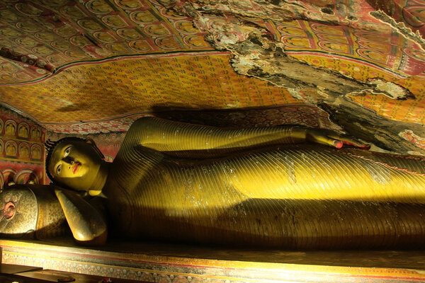 Reclining Buddha at Golden Temple of Dambulla in Sri Lanka