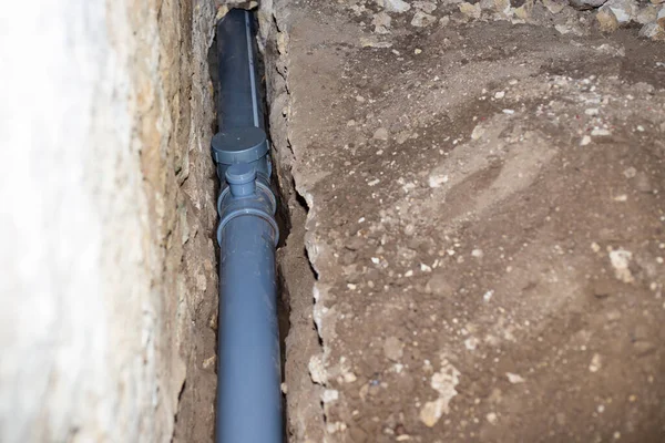 lining sewage with plastic pipes, drainage of waste water from the house.