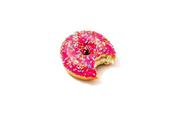 Bitten pink donut on a white background — Stock Photo, Image