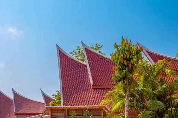 tiled roofs of buildings in Asia against the sky,traditions and culture